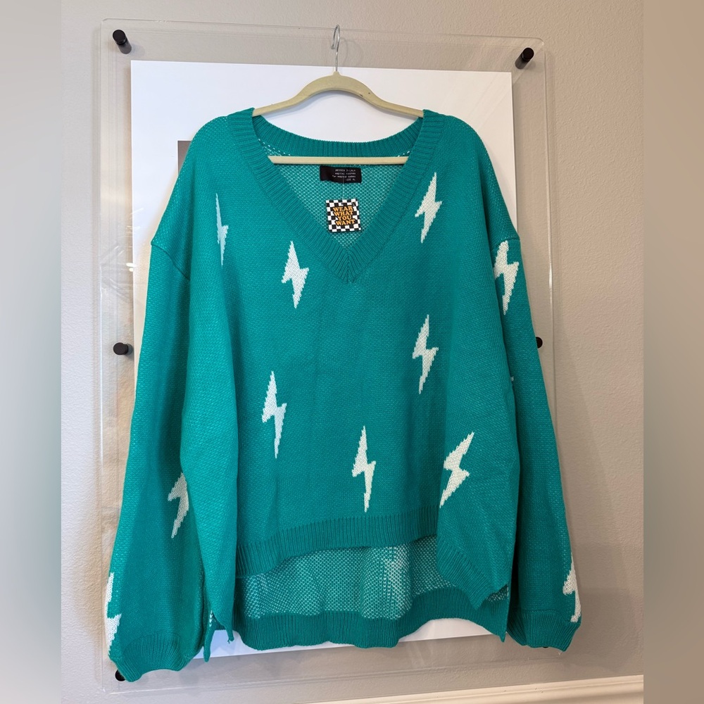 Dressed in LALA Emerald V-Neck Sweater with Lightning Bolts